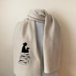 Bookworm Scarf on mannequin with cozy fleece texture